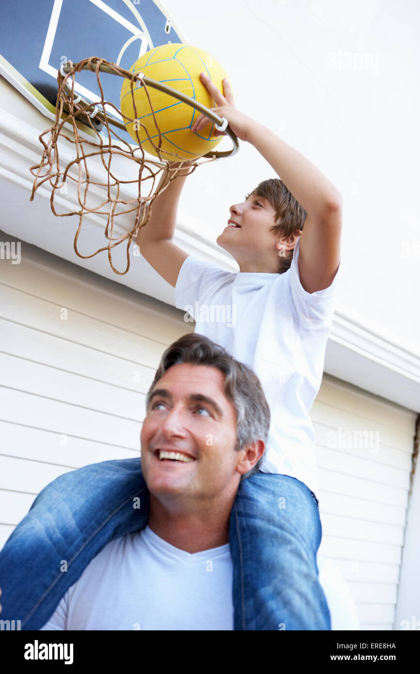 Father And Son Family Playing Basketball Outside Garage Stock Photo - Alamy