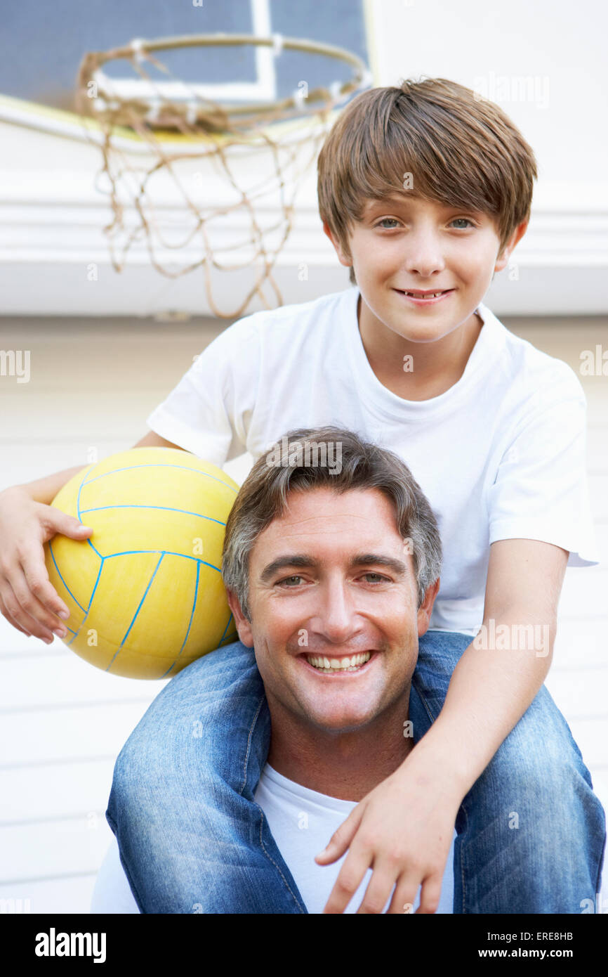 Father And Son Family Playing Basketball Outside Garage Stock Photo - Alamy