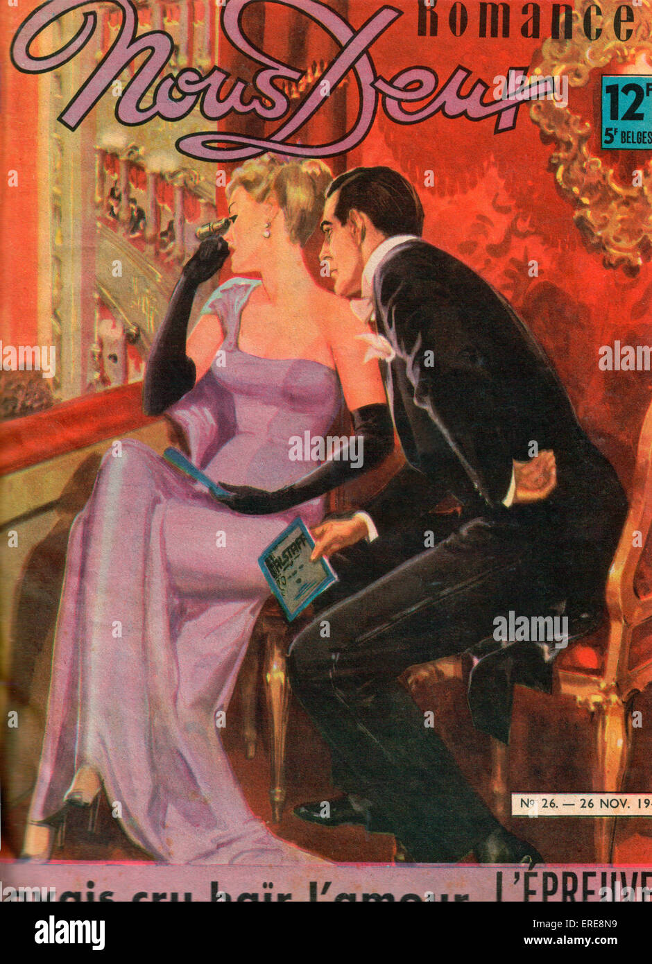 Cover of French romance magazine Nous Deux, 1947. An elegant couple in evening dress are sitting in a theatre box, the man Stock Photo