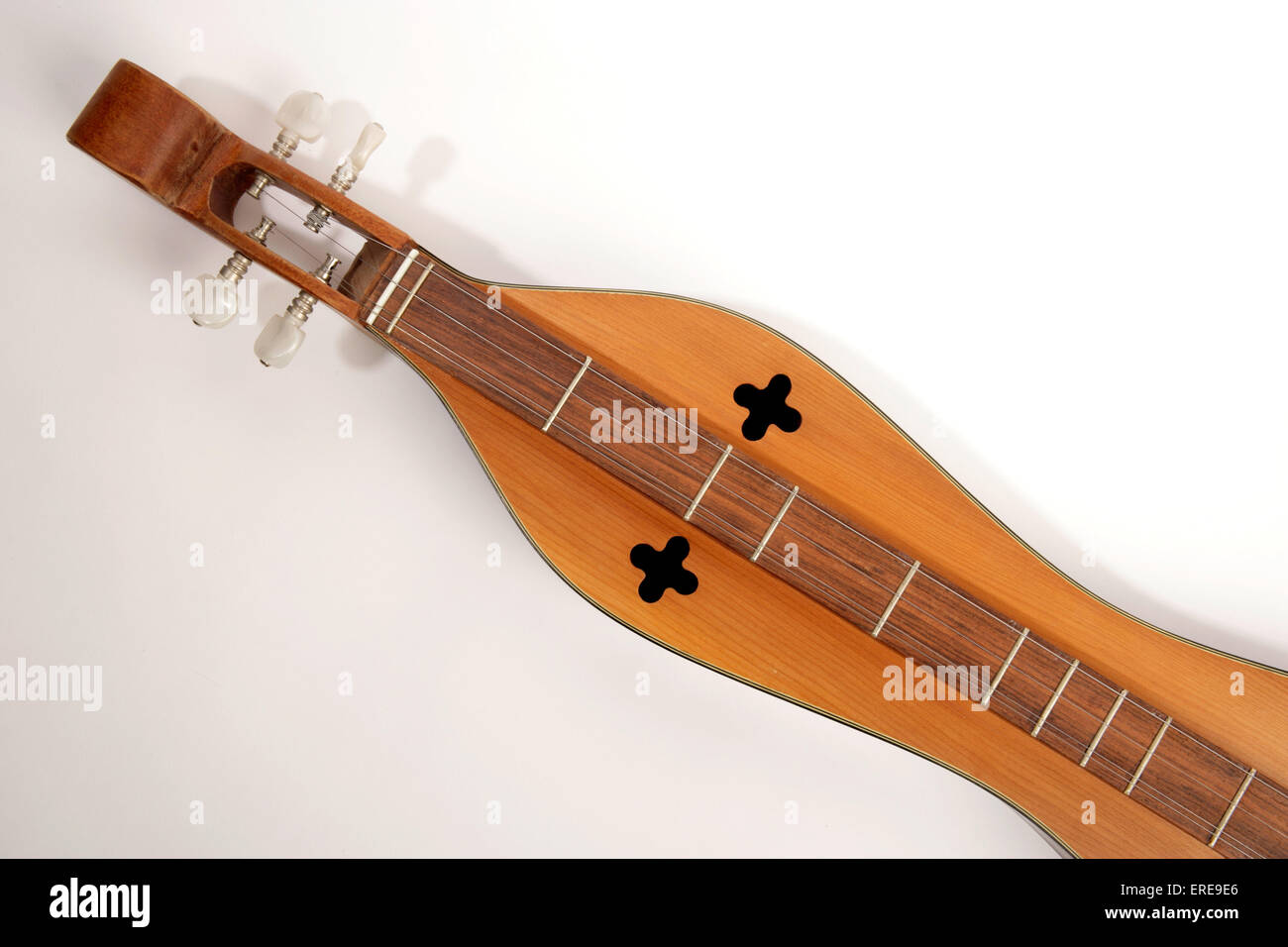 4 string Appalachian Dulcimer, also known as Mountain Dulcimer or mountain zither. Close up detail of strings and sound holes Stock Photo