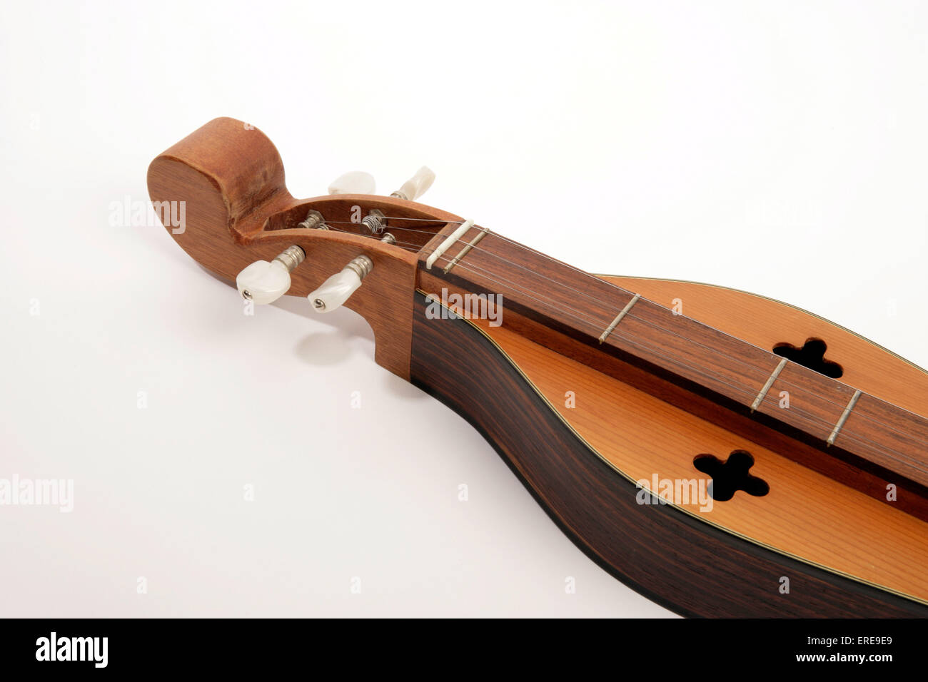 4 string Appalachian Dulcimer, also known as Mountain Dulcimer or mountain zither. Close up detail of strings and tuning pegs Stock Photo