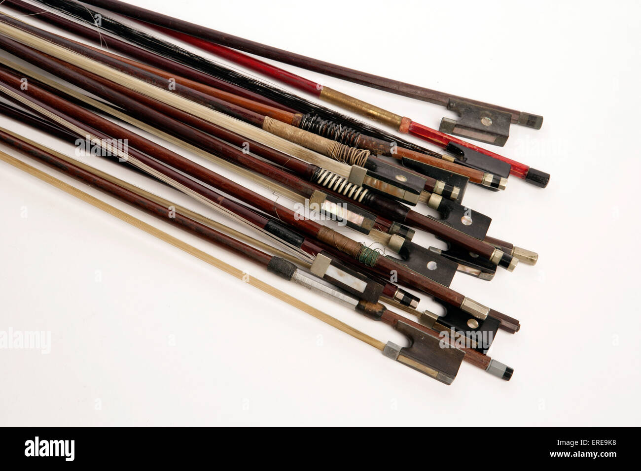 Collection of 12 old violin bows Stock Photo