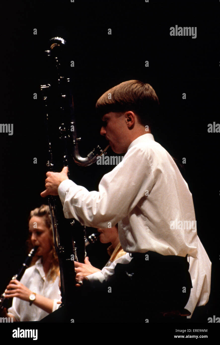 Boy playing contra bass clarinet in youth orchestra Stock Photo
