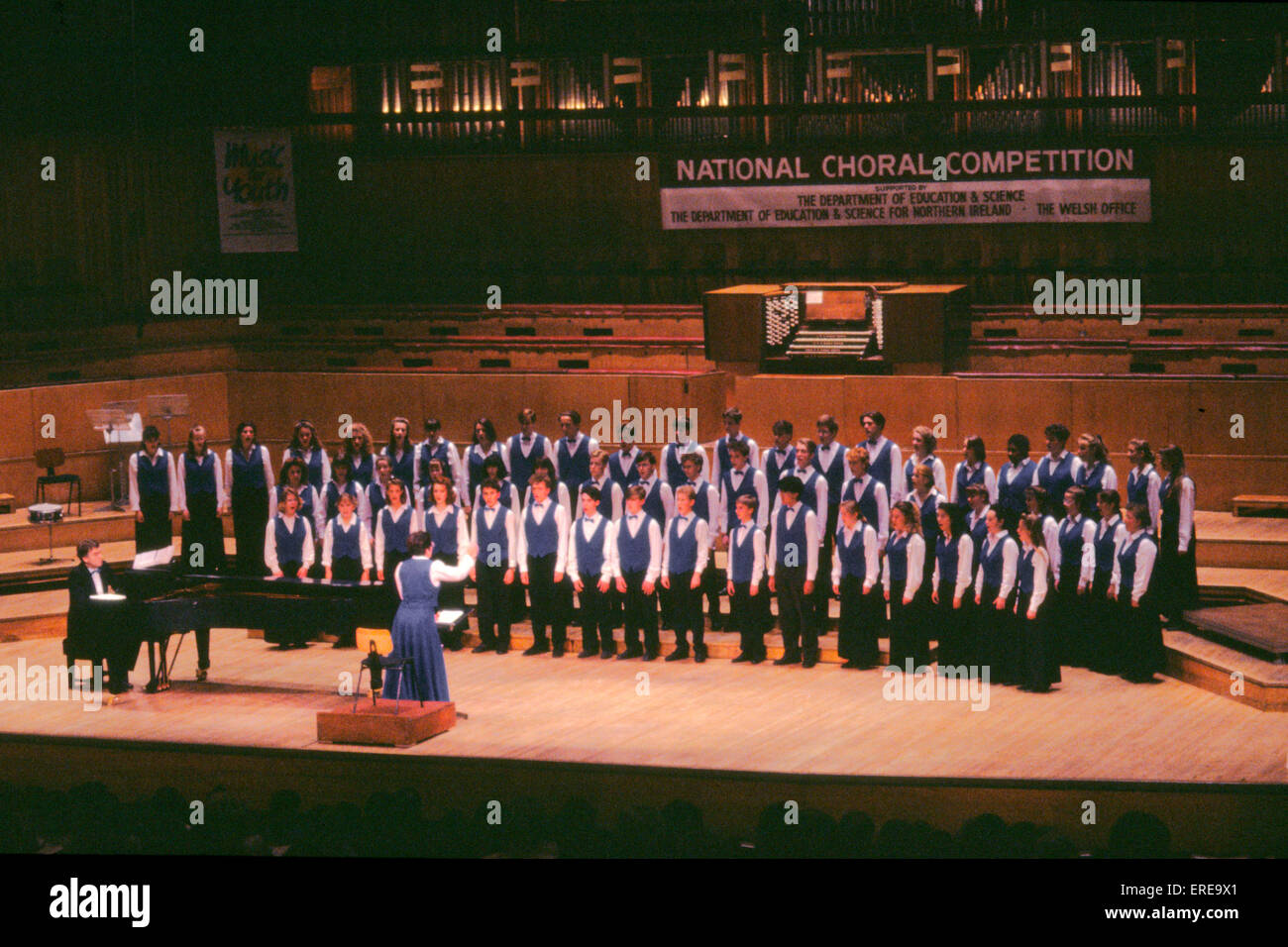 Choir boys singing. National choral competition. Conductor. Stock Photo