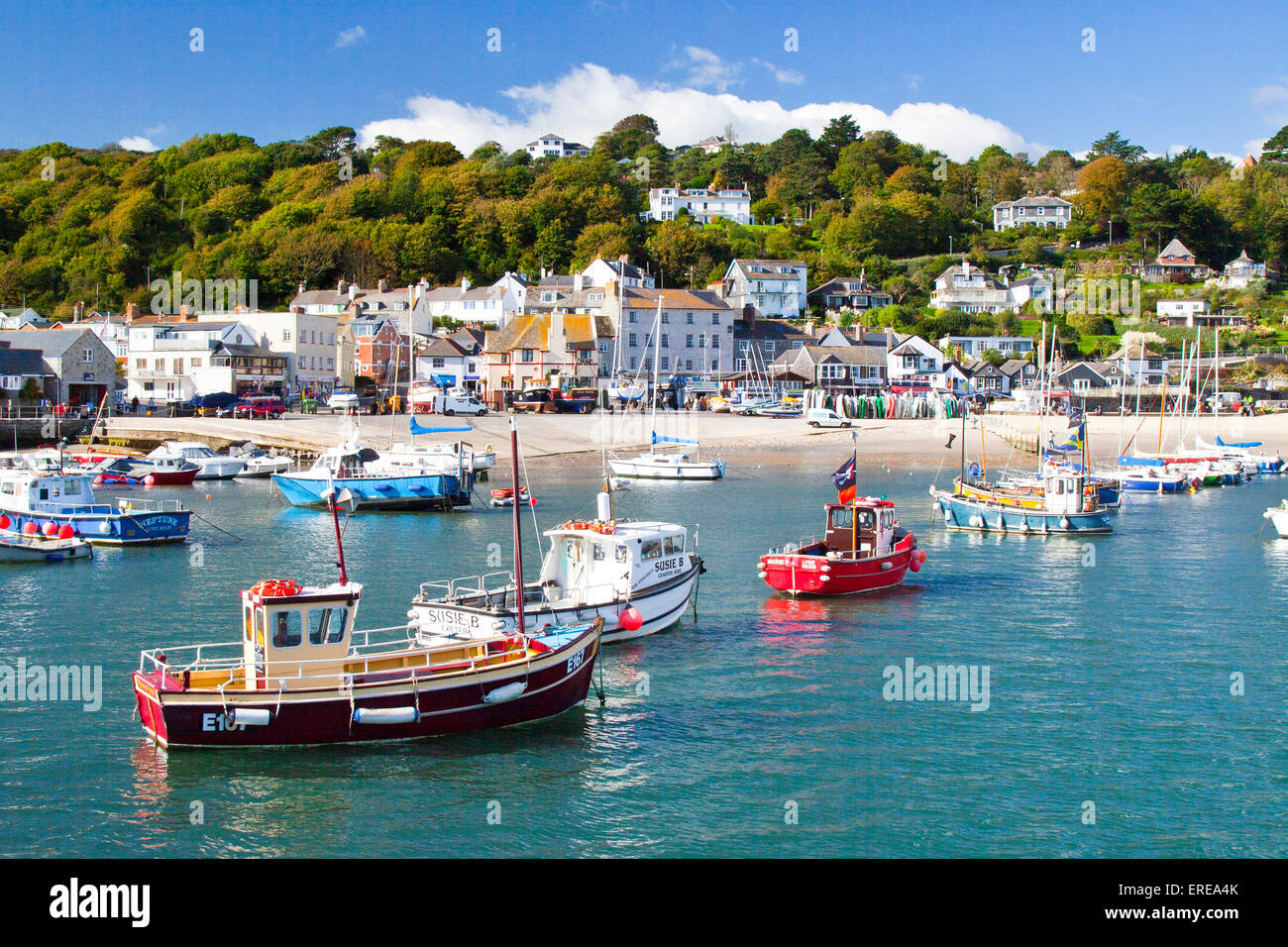 An assortment of colourful boats in Lyme Regis harbour on the Jurassic Coast, Dorset, England, UK Stock Photo