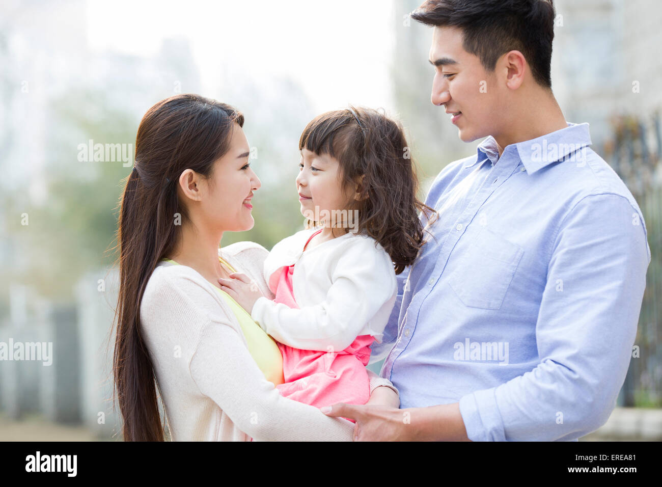 Happy young family Stock Photo - Alamy