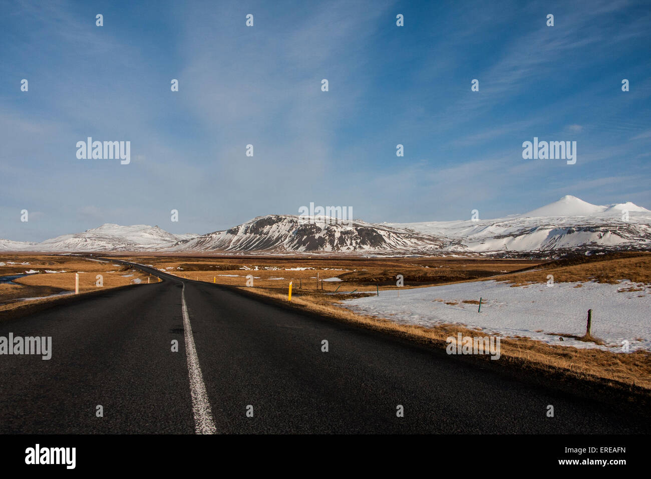 Empty road through snow mountains hi-res stock photography and images ...