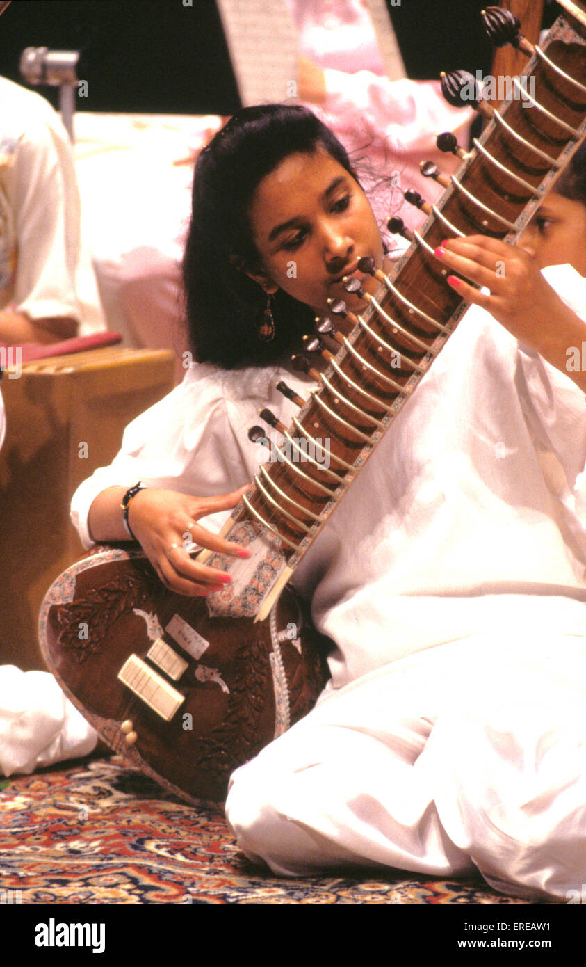 Young girl playing the sitar Stock Photo Alamy
