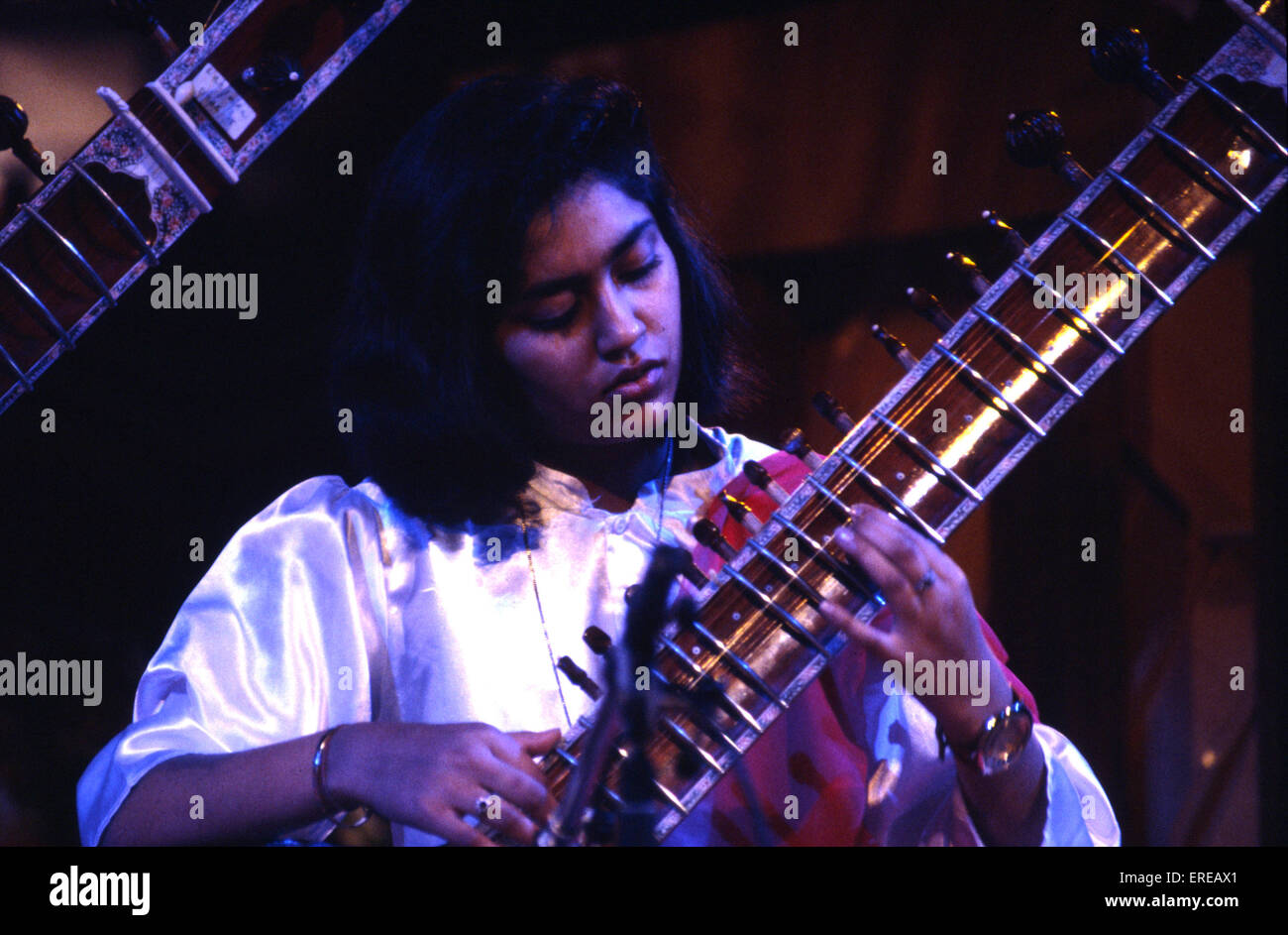 Young girl playing the sitar neck Stock Photo Alamy