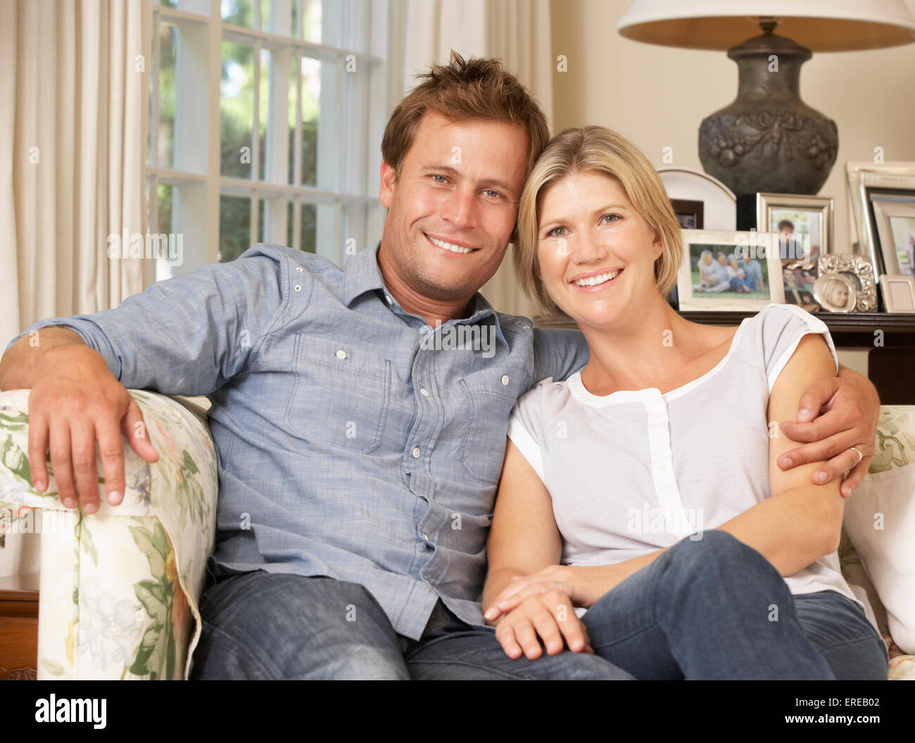Sitting couple on sofa hi-res stock photography and images - Alamy
