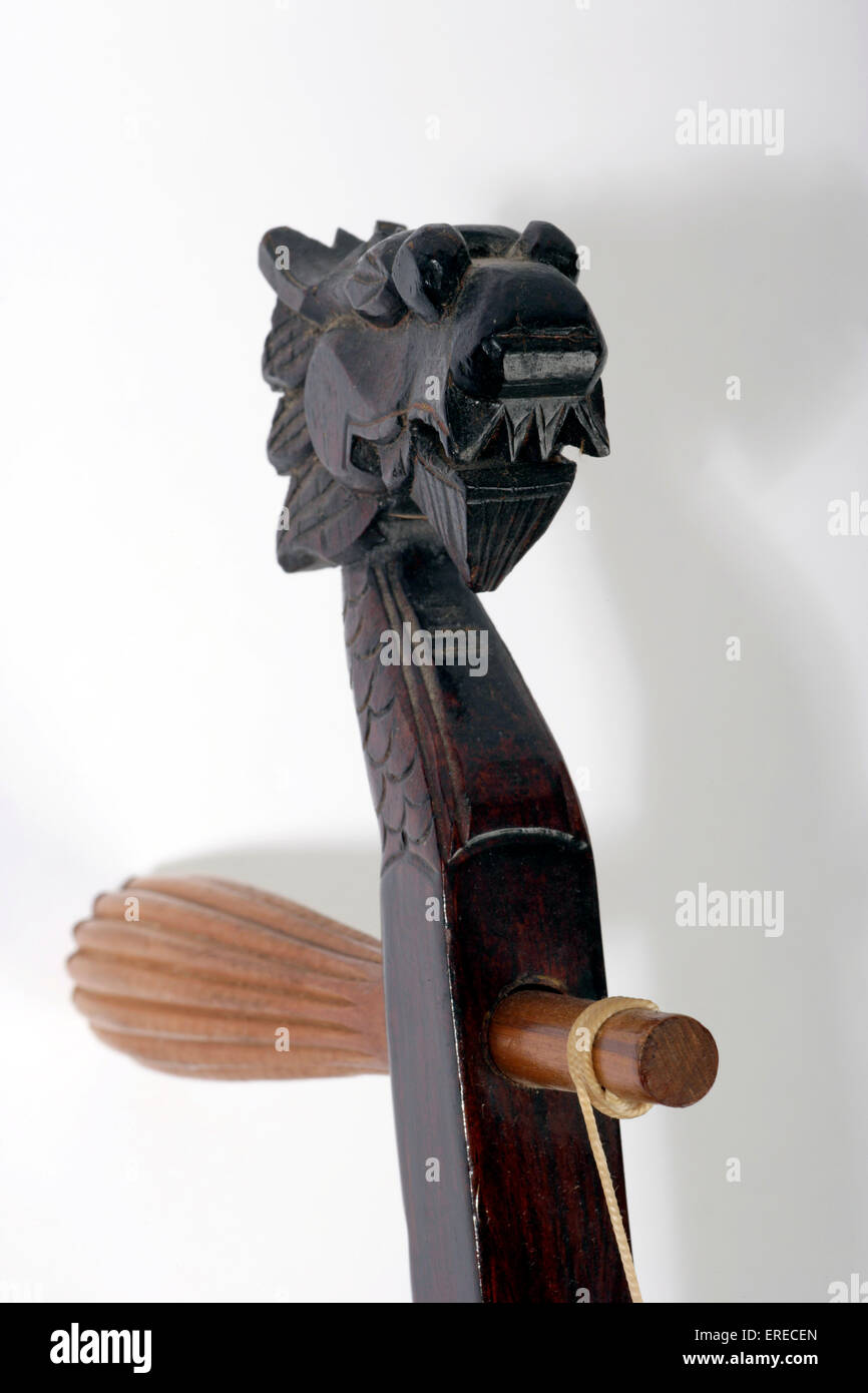 Erhu, detail of dragons-head scroll and tuning peg. Stock Photo