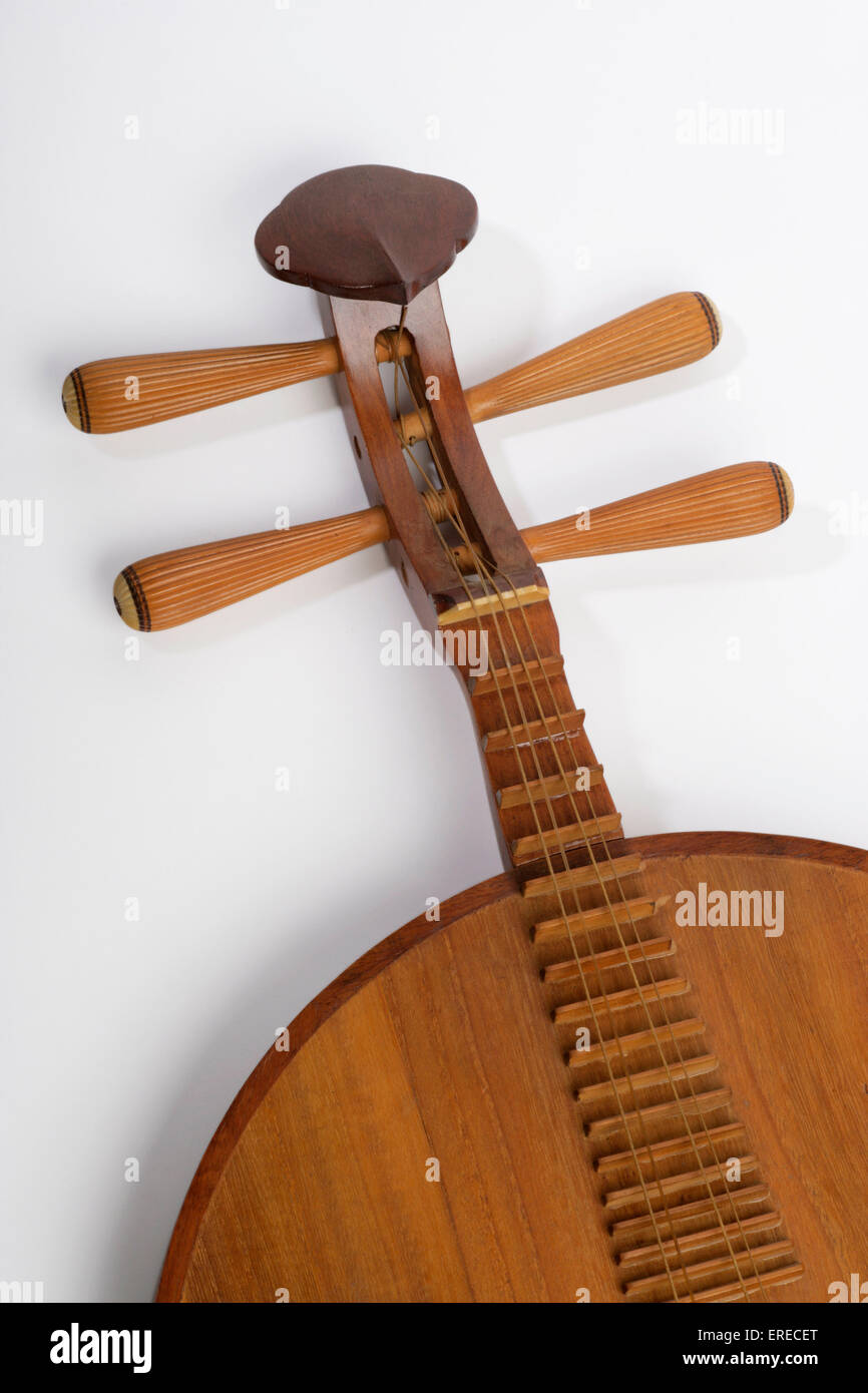 Chinese Moon shaped lute, or moon guitar. Yueh chin. Yueqin. Detail of scroll strings and tuning pegs. Stock Photo