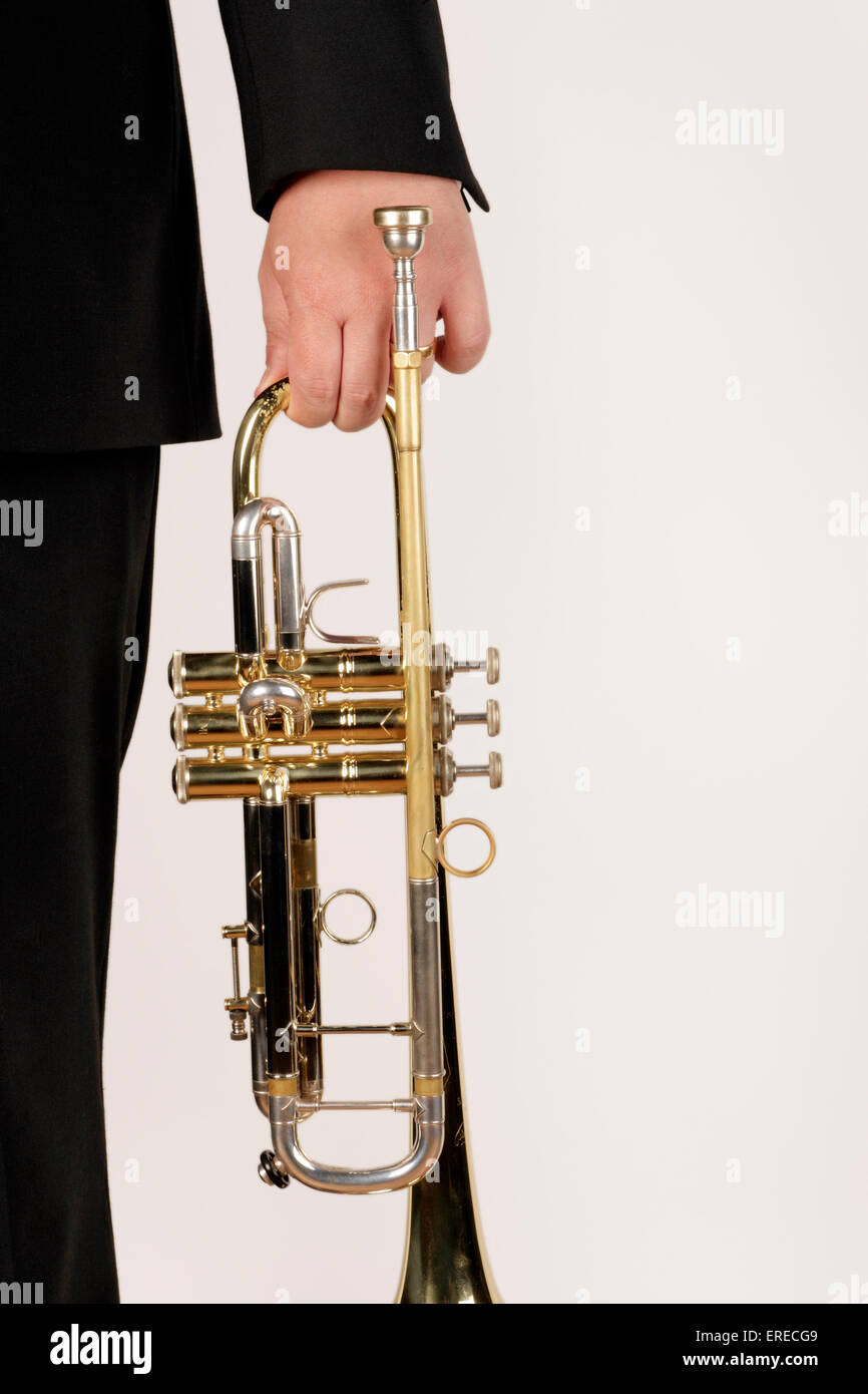 Trumpet being held in one hand Stock Photo - Alamy