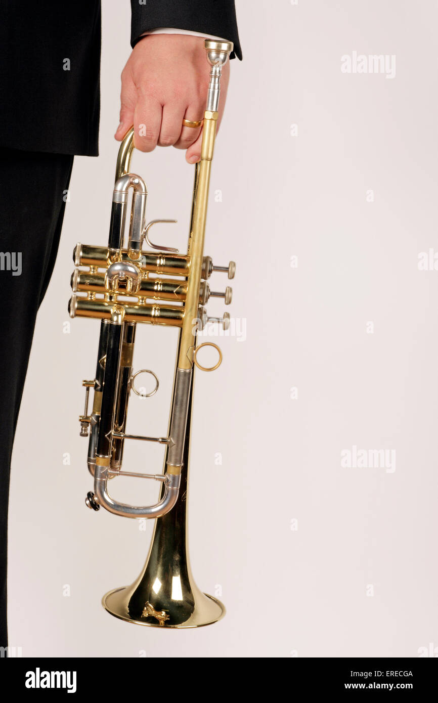 Trumpet being held in one hand Stock Photo - Alamy