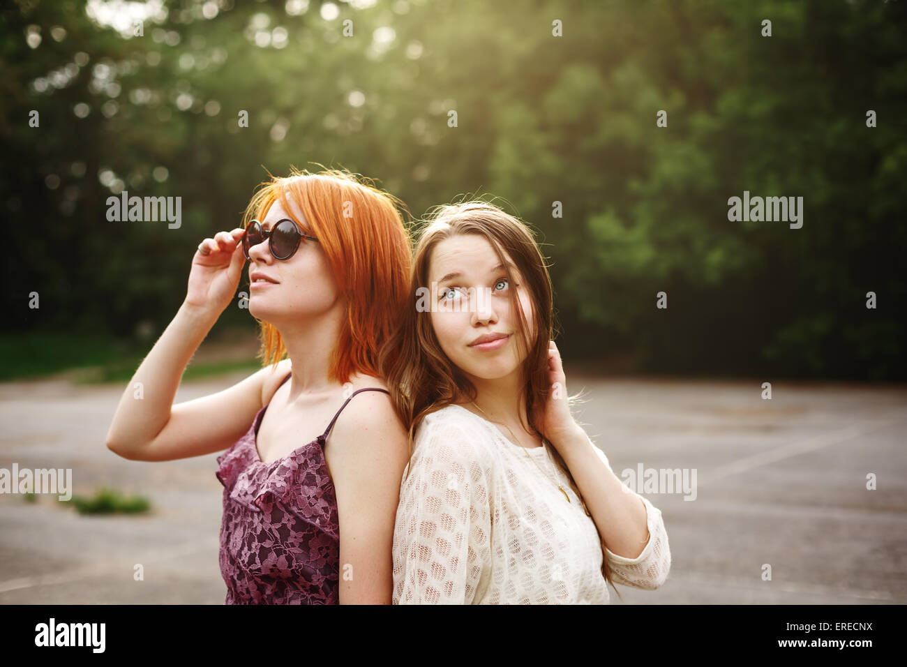 Close Up Portrait Of Two Teen Girls Holding Hands.African Teen Standing On  Beach With Caucasian Friend. Stock Photo, Picture and Royalty Free Image.  Image 61355887.