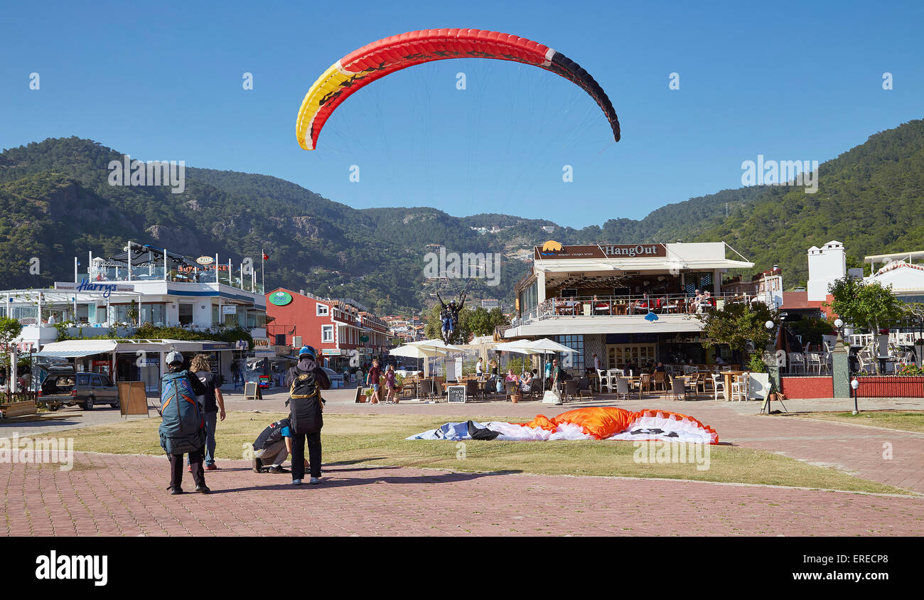 Paragliding in Oludeniz, Near Fethiye, Turkey. Coming in to land on the beachfront. Stock Photo