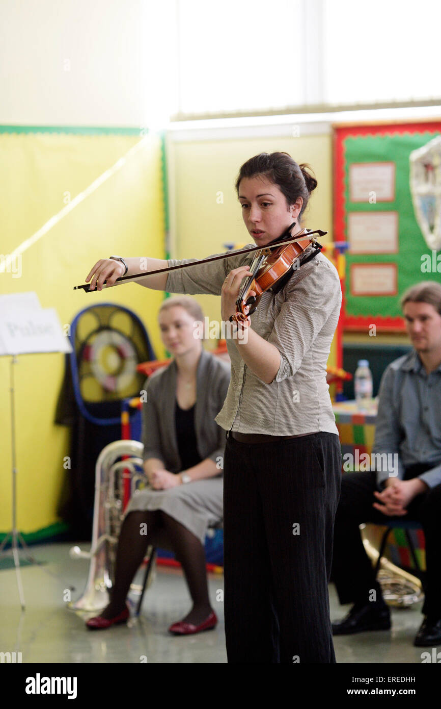 Violin player, a workshop leader in a music workshop Stock Photo