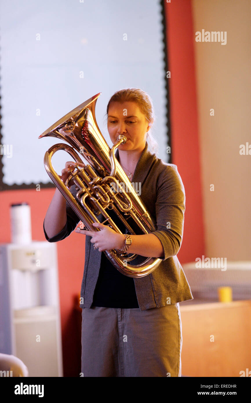 Euphonium player playing in a classroom Stock Photo - Alamy