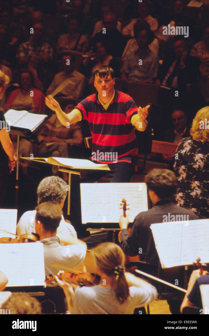 Christian Thielemann conducting, May 1998.  German conductor, b. 1959.  Rehearsing with Royal Opera Chorus and Orchestra of Stock Photo