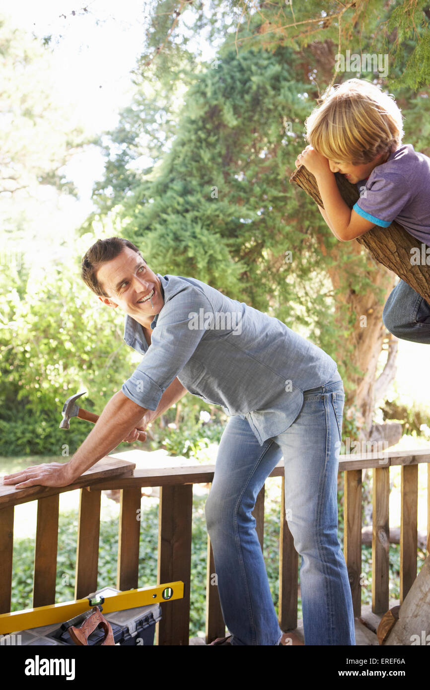 Father And Son Building Tree House Together Stock Photo 83297826