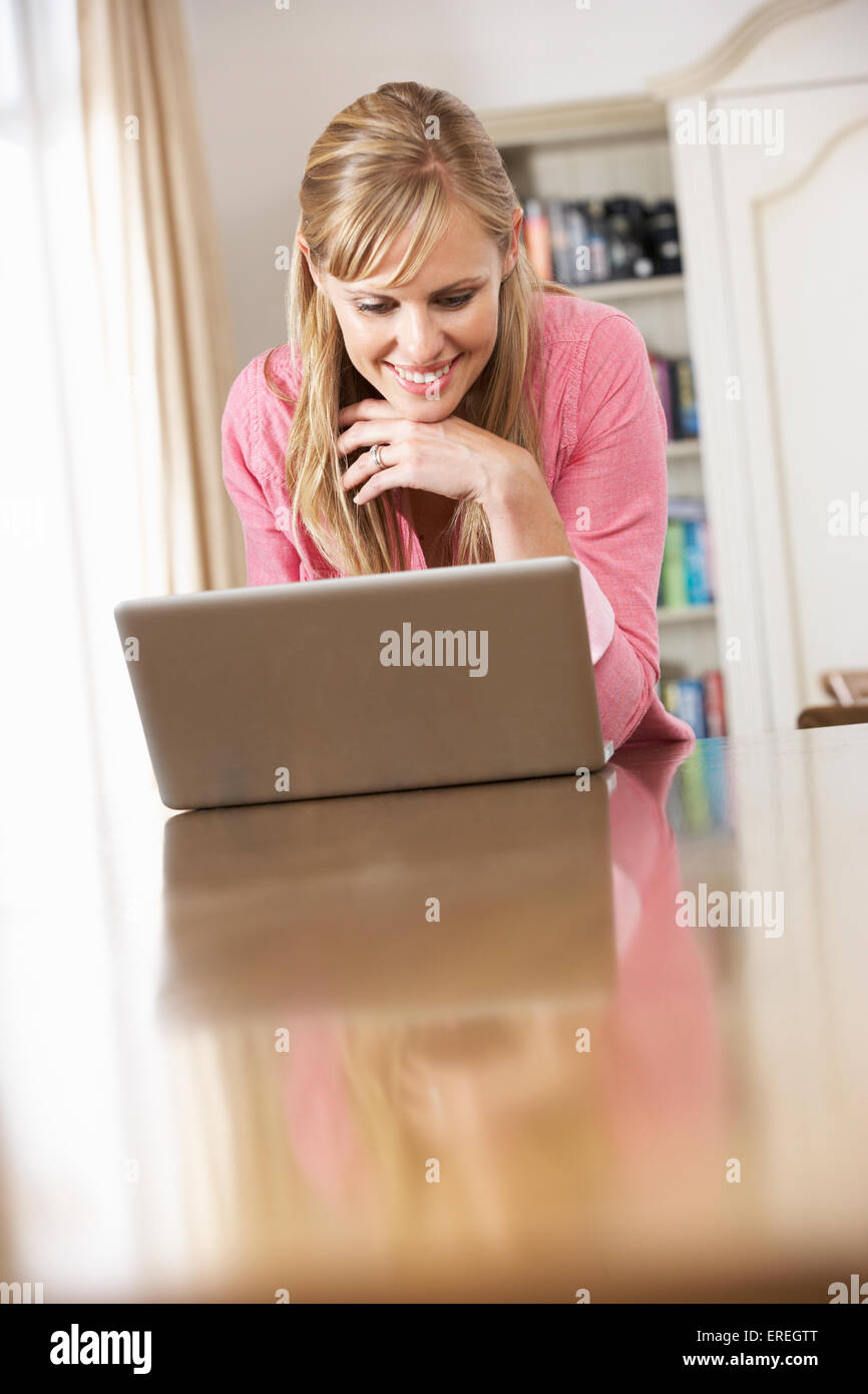 Woman Using Laptop Computer At Home Stock Photo - Alamy