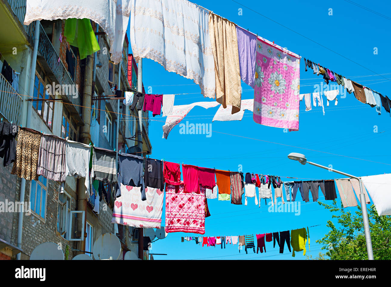 Clothes drying in traditional way on the street of Batumi, Georgia Stock Photo