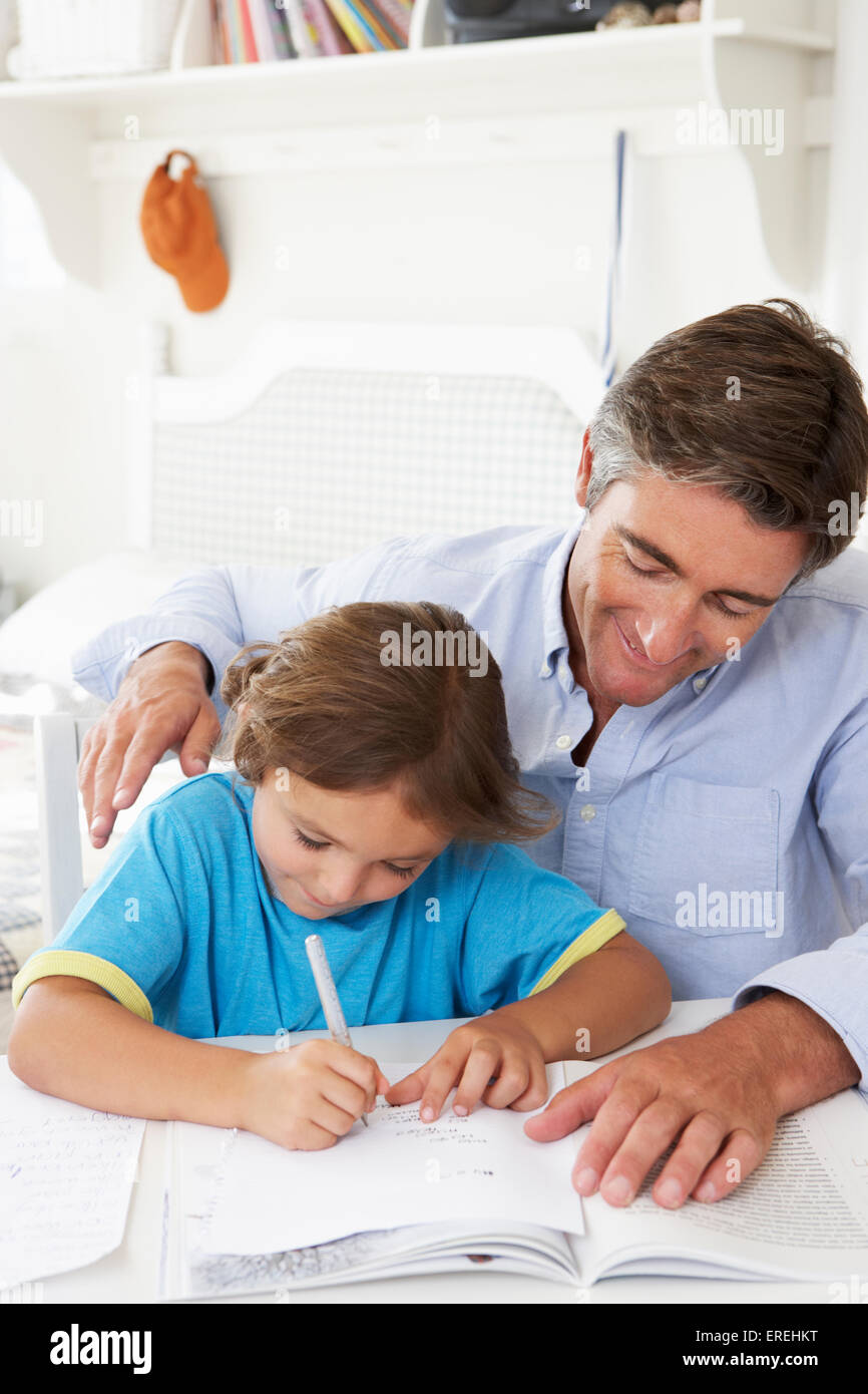 Father Helping Son With Homework Stock Photo - Alamy