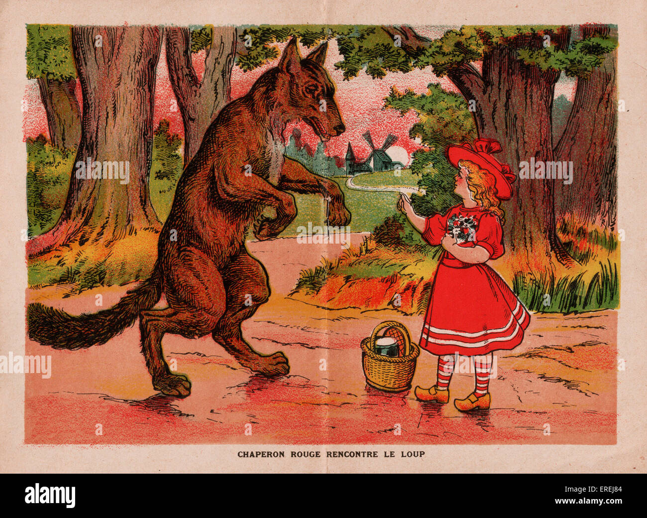 Hukommelse efterligne egyptisk Illustration in French edition of Little Red Riding Hood, c. 1913. A little  girl in a red dress and hat is talking to a huge Stock Photo - Alamy