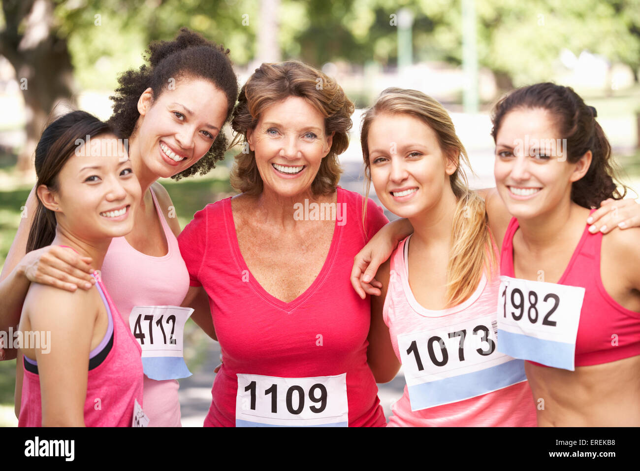 Group Of Female Athletes Competing In Charity Marathon Race Stock Photo