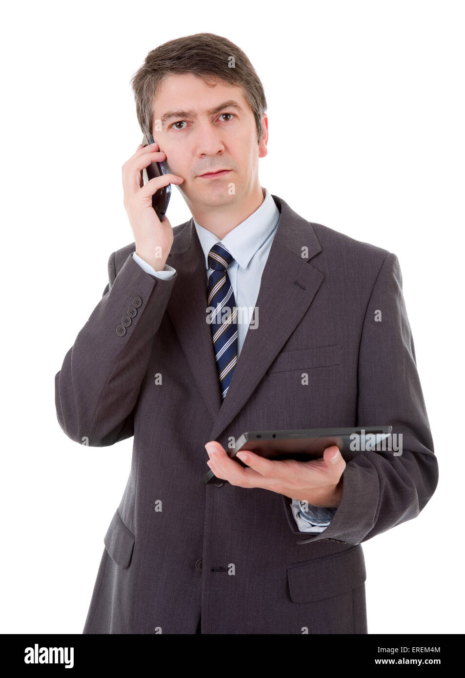 businessman using touch pad of tablet pc on the phone, isolated Stock