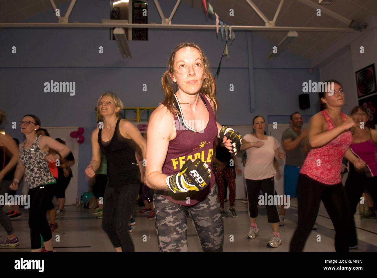 Women taking part in a Insanity Combat-Athon for a cancer charity, Alton, Hampshire, UK. Stock Photo