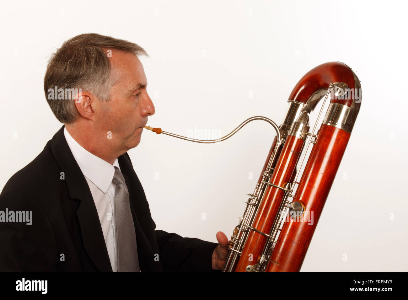 Contra Bassoon player in playing position, close up detail of crook and