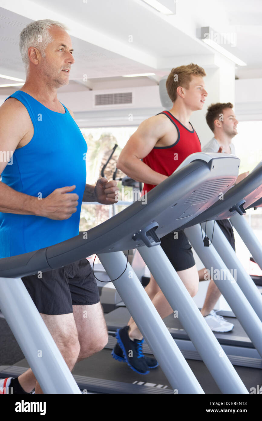 Group Of Men Using Running Machines In Gym Stock Photo Alamy