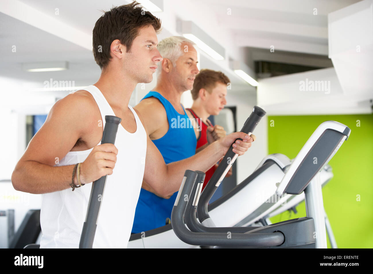 Group Of People Using Different Gym Equipment Stock Photo