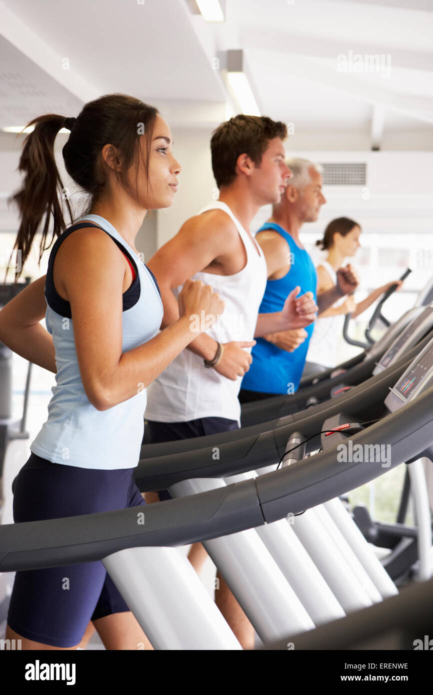 Group Of People Using Different Gym Equipment Stock Photo
