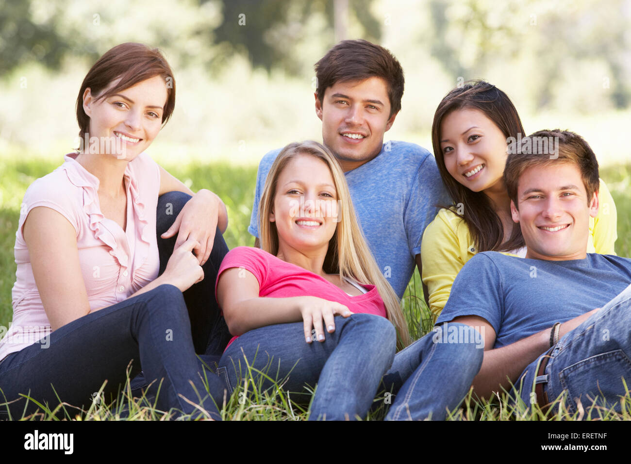 Group Of Young Friends Relaxing In Countryside Stock Photo - Alamy
