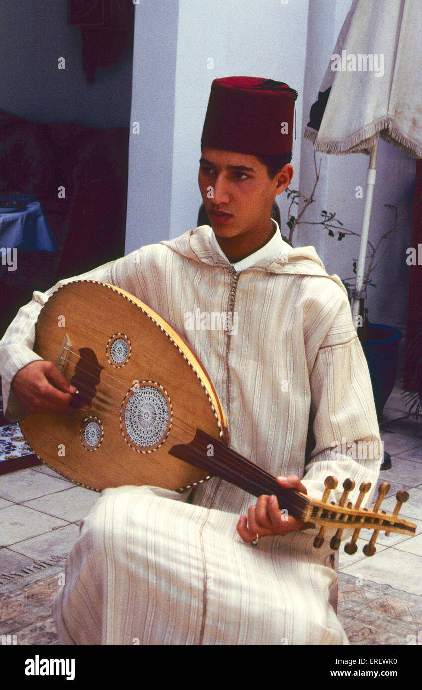 Moroccan musician playing an oud  near Djemaa-el-Fna square in Marrakesh, Morocco. (al-oud = lute). Stock Photo