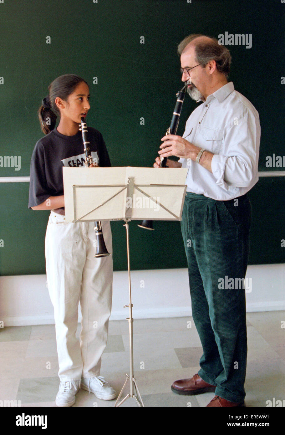 Male teacher with teenage female student Stock Photo Alamy