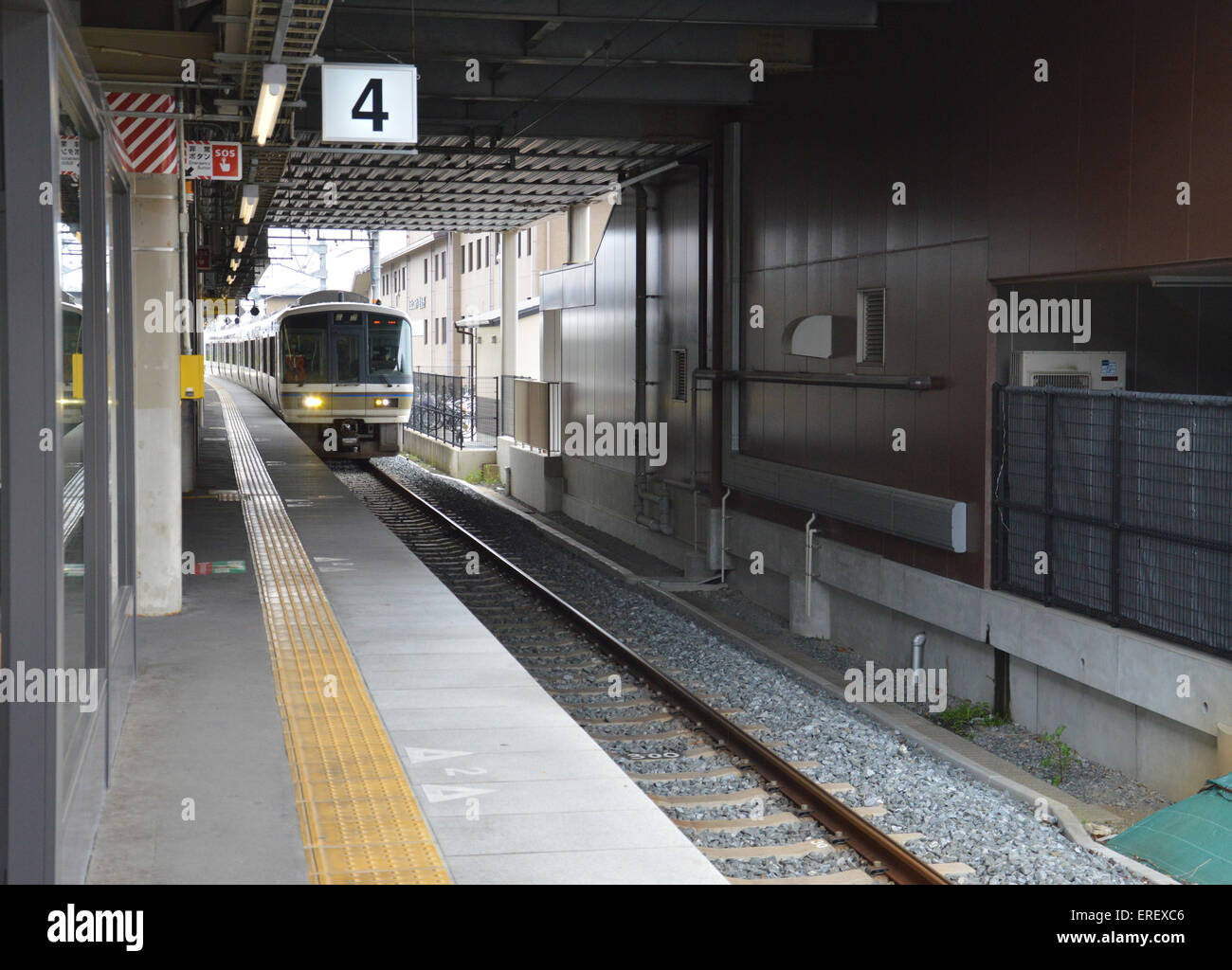 local train japan, electric train entering station Stock Photo - Alamy