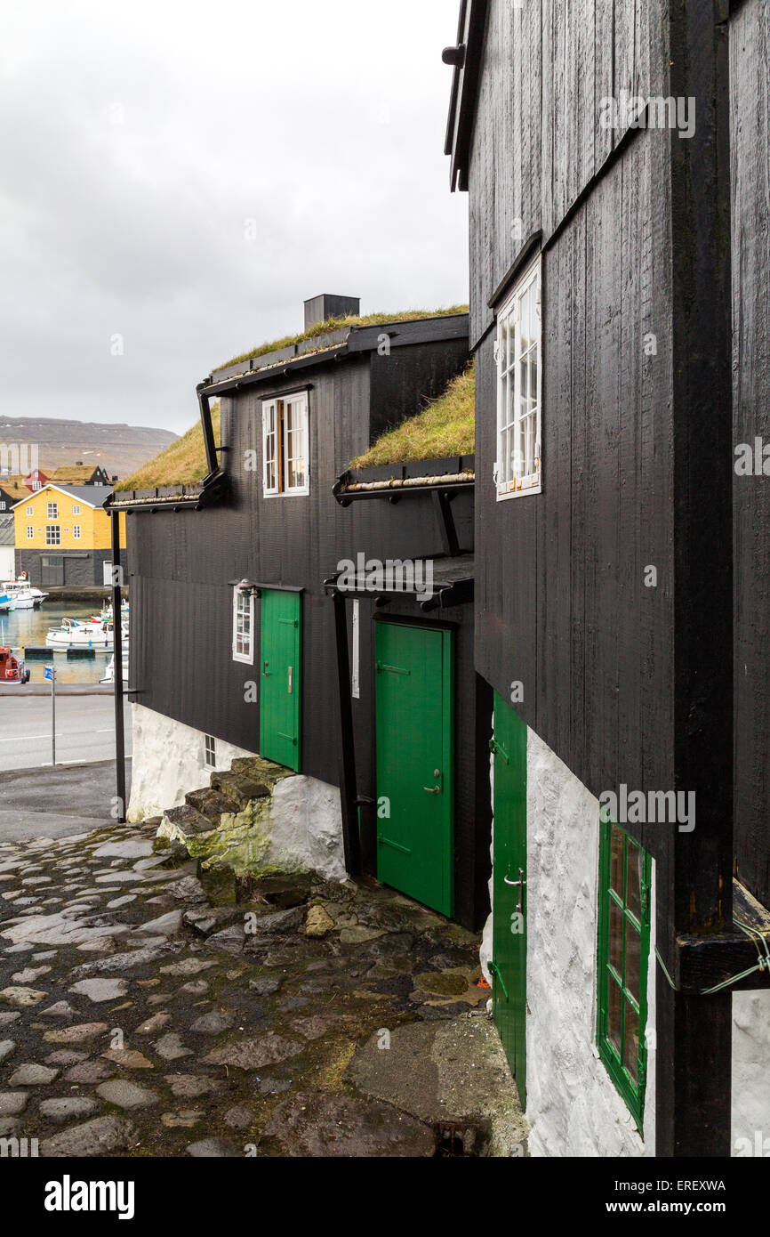 Traditional black wood and stone houses next to the harbour in Torshavn, Faroe Islands Stock Photo