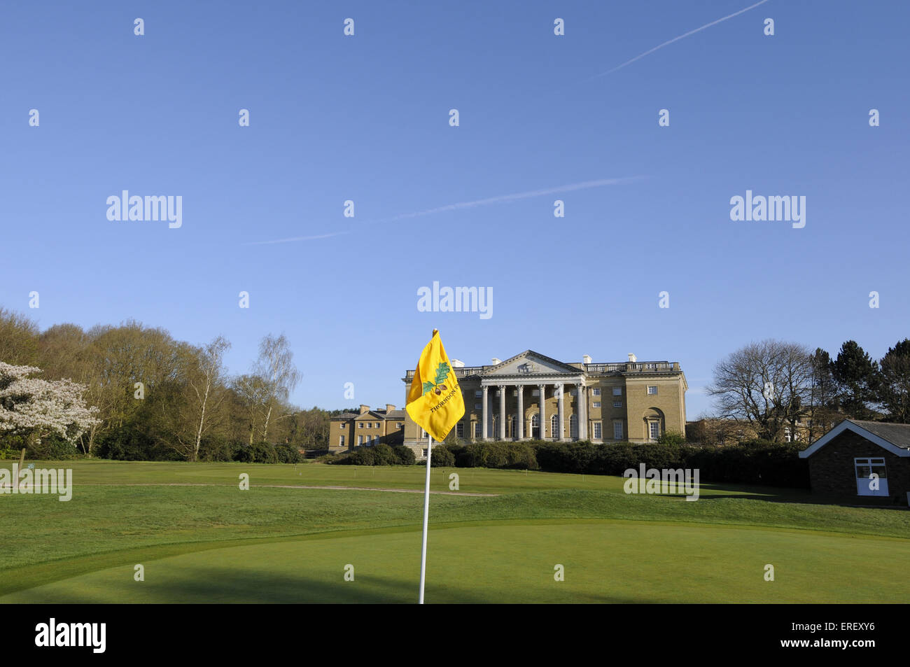 View over flag on 18th Green to Thorndon Hall, Thorndon Park Golf Club Brentwood Essex England Stock Photo
