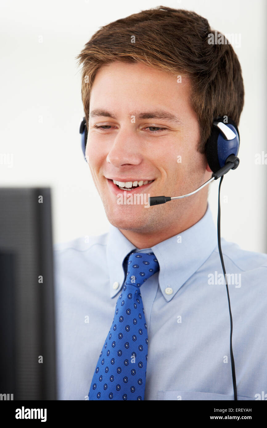 Friendly Service Agent Talking To Customer In Call Centre Stock Photo ...