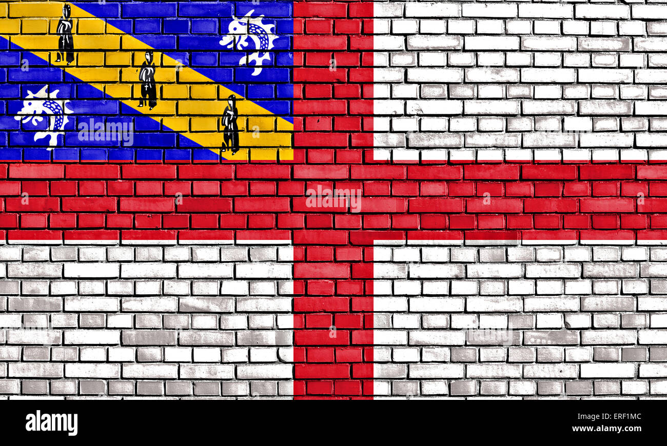flag of Herm painted on brick wall Stock Photo