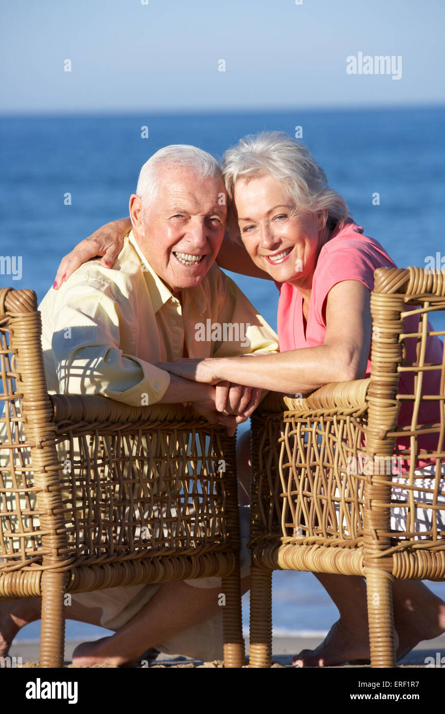 Senior Couple Sitting In Chairs Relaxing On Beach Stock Photo - Alamy