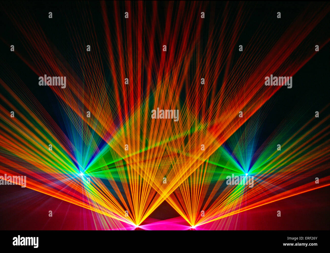 Thin, multicoloured laser beams forming a fan pattern demonstration at the annual Frankfurt