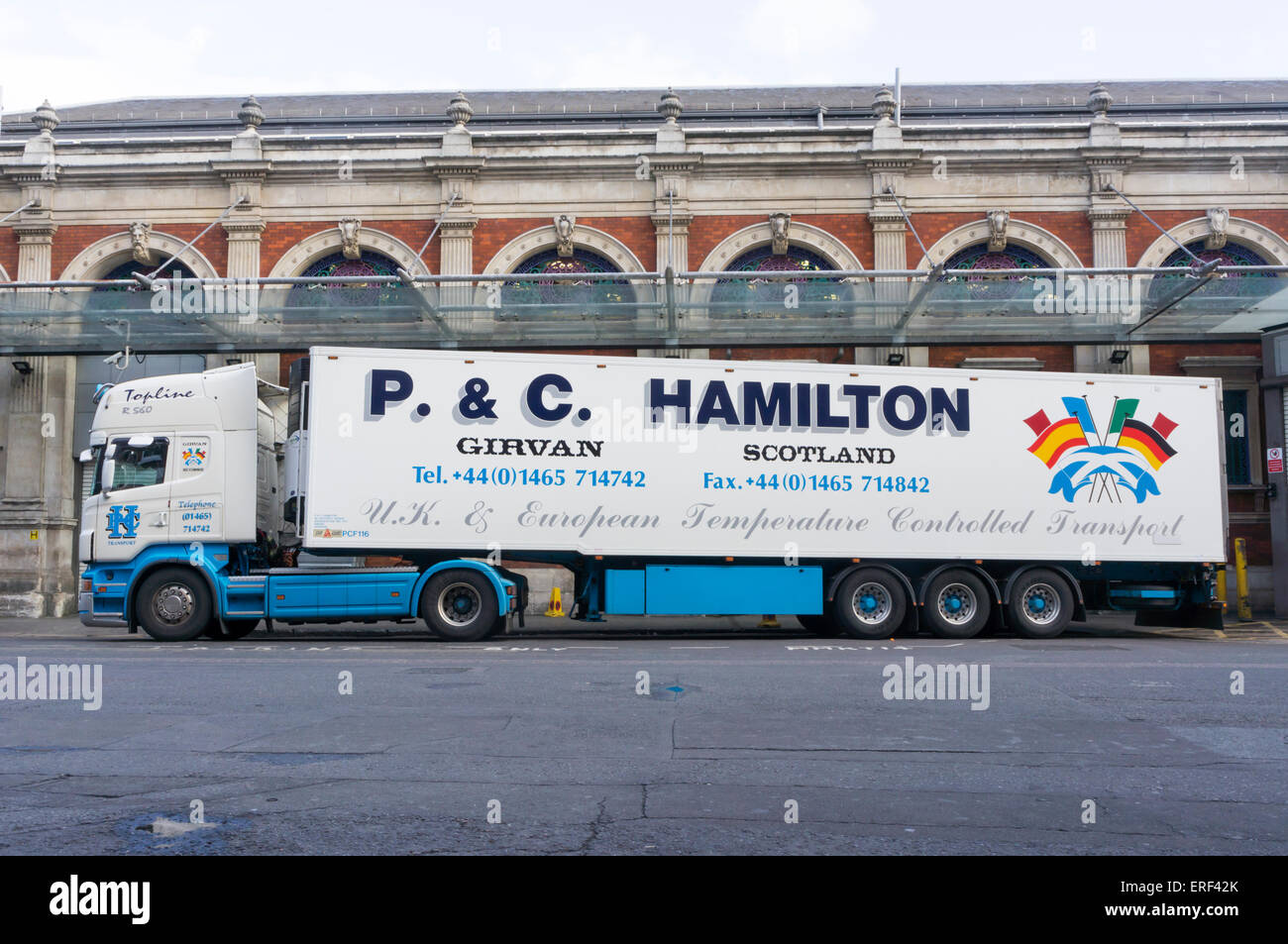 Large refrigerated transporter from P & C Hamilton of Girvan, parked in a loading bay at Smithfield Market. Stock Photo