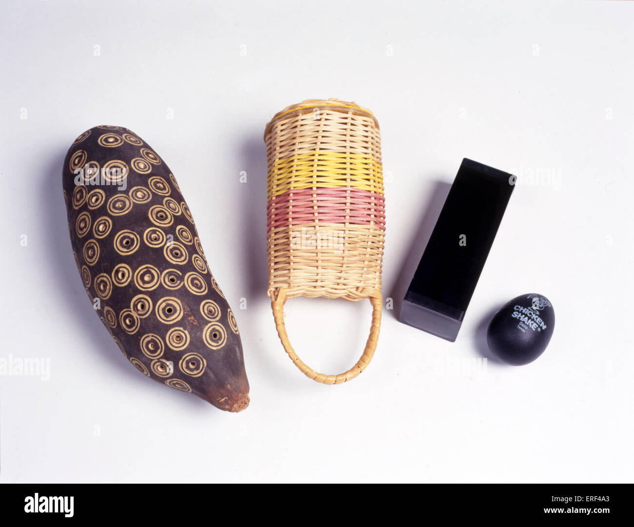 Selection of shakers (left to right): natural pod; kaxixi (wicker basket); metal; plastic. Stock Photo