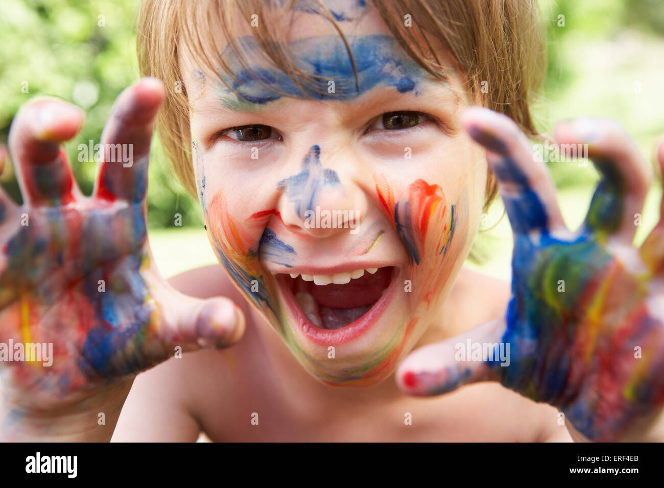 Portrait Of Boy With Painted Face and Hands Stock Photo