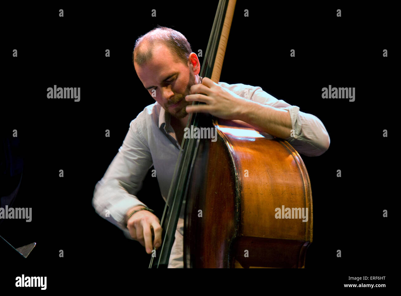 French double bass player Sylvain Romano (b. 26/03/1980, Marseille) performing with the Stéphane Belmondo Quartet in Alès, Stock Photo