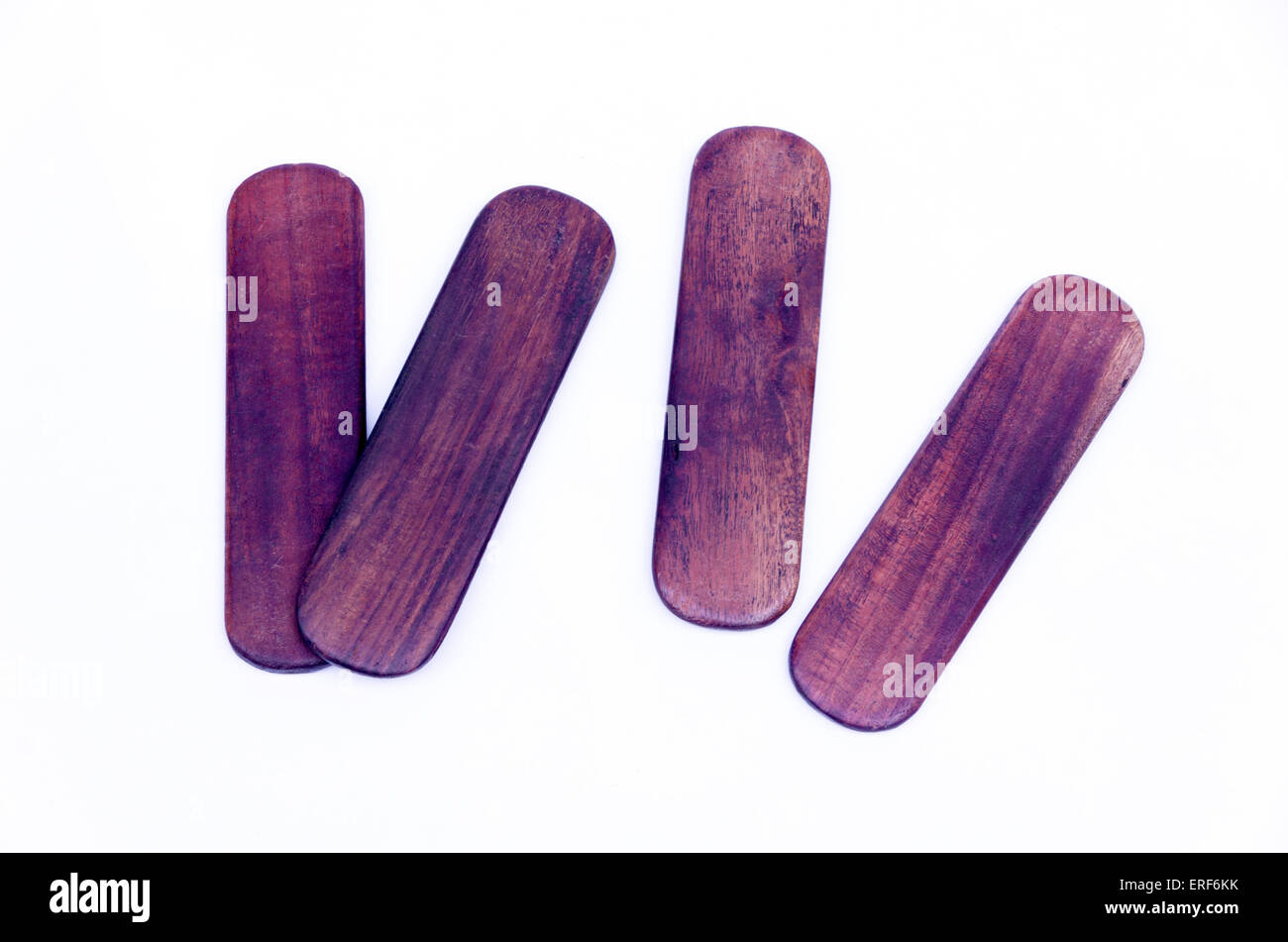 A pair of khartals. The khartal comprises two similar shaped wooden pieces and is played by the same hand, like castanets. Stock Photo